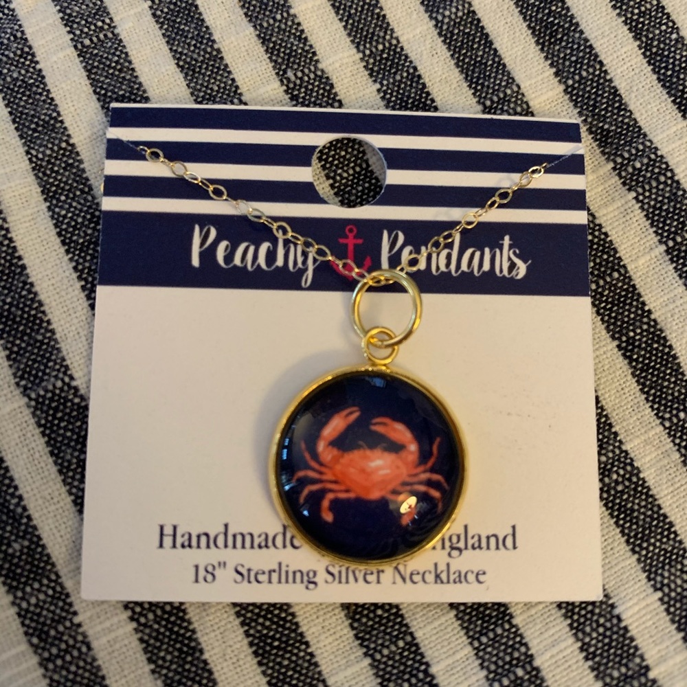Gold necklace and crab pendant